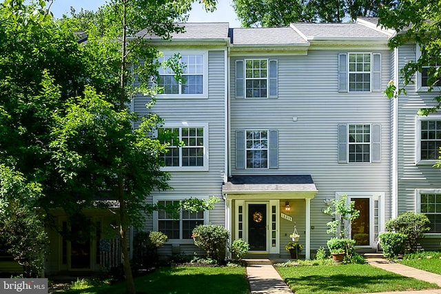view of property with a front lawn