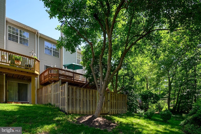 rear view of property featuring a deck