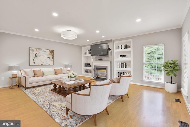 43413 Countrywalk Ct, Ashburn, VA 20147 - living room with a fireplace with flush hearth, light wood-type flooring, ornamental molding, recessed lighting, and baseboards