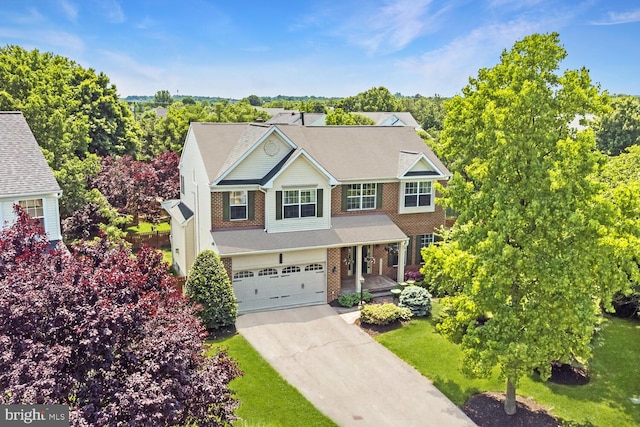43413 Countrywalk Ct, Ashburn, VA 20147 - view of front of home with brick siding, a garage, concrete driveway, and a front yard