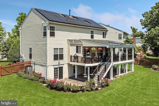 43413 Countrywalk Ct, Ashburn, VA 20147 - back of property with stairs, a deck, a patio area, and solar panels