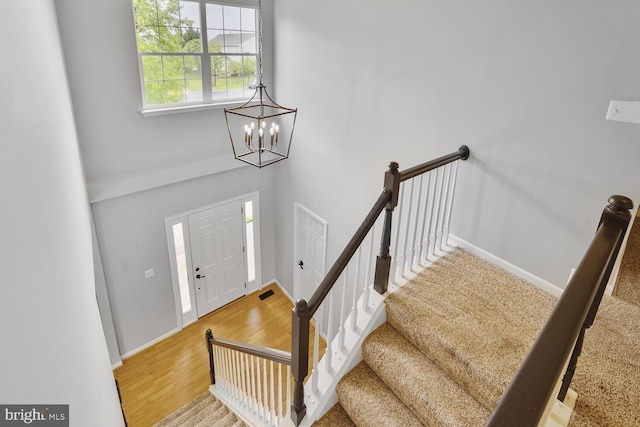 43413 Countrywalk Ct, Ashburn, VA 20147 - entrance foyer featuring a chandelier, wood finished floors, and baseboards