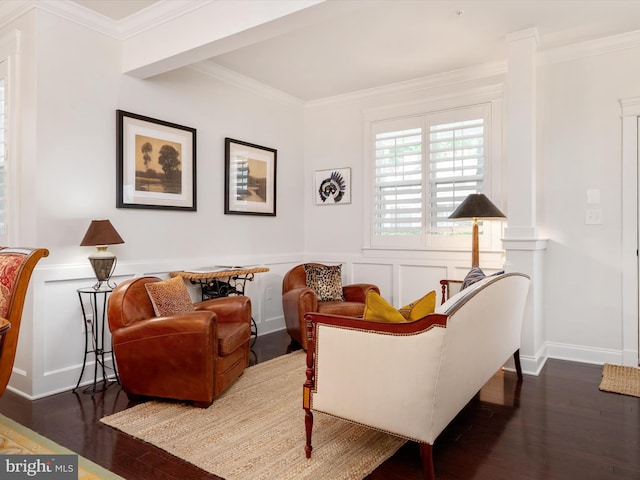 816 Bay Ridge Ave, Annapolis, MD 21403 - living room with dark wood-style flooring, ornamental molding, a decorative wall, and a wainscoted wall