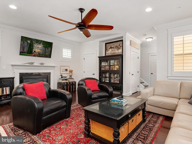 816 Bay Ridge Ave, Annapolis, MD 21403 - living room with ornamental molding, wood finished floors, ceiling fan, recessed lighting, and a glass covered fireplace
