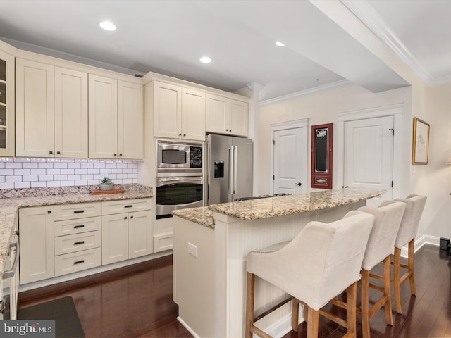 816 Bay Ridge Ave, Annapolis, MD 21403 - kitchen featuring appliances with stainless steel finishes, ornamental molding, dark wood-style flooring, decorative backsplash, and glass insert cabinets
