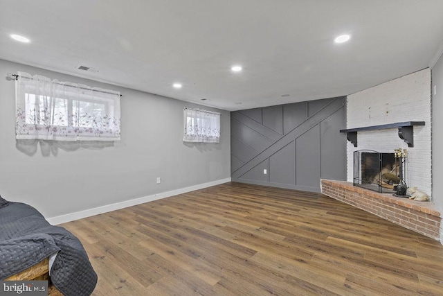 1604 Old New Windsor Rd, New Windsor, MD 21776 - unfurnished living room with baseboards, wood finished floors, a brick fireplace, and recessed lighting