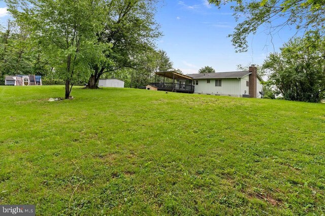 1604 Old New Windsor Rd, New Windsor, MD 21776 - view of grassy yard featuring a deck and an outdoor structure