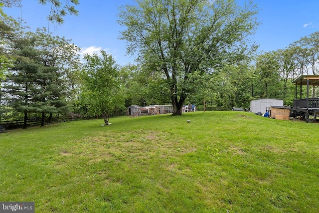 1604 Old New Windsor Rd, New Windsor, MD 21776 - view of green lawn featuring a storage unit and an outbuilding