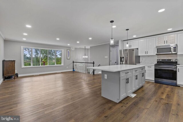 1604 Old New Windsor Rd, New Windsor, MD 21776 - kitchen with appliances with stainless steel finishes, open floor plan, recessed lighting, crown molding, and a kitchen island