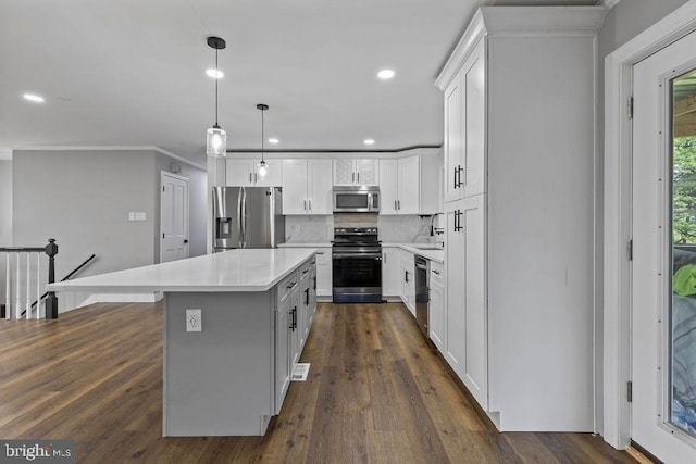 1604 Old New Windsor Rd, New Windsor, MD 21776 - kitchen featuring stainless steel appliances, light countertops, a sink, backsplash, and a center island