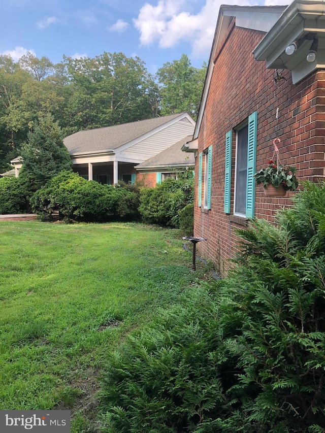 337 Carrsbrook Dr, Charlottesville, VA 22901 - view of side of home with brick siding and a lawn