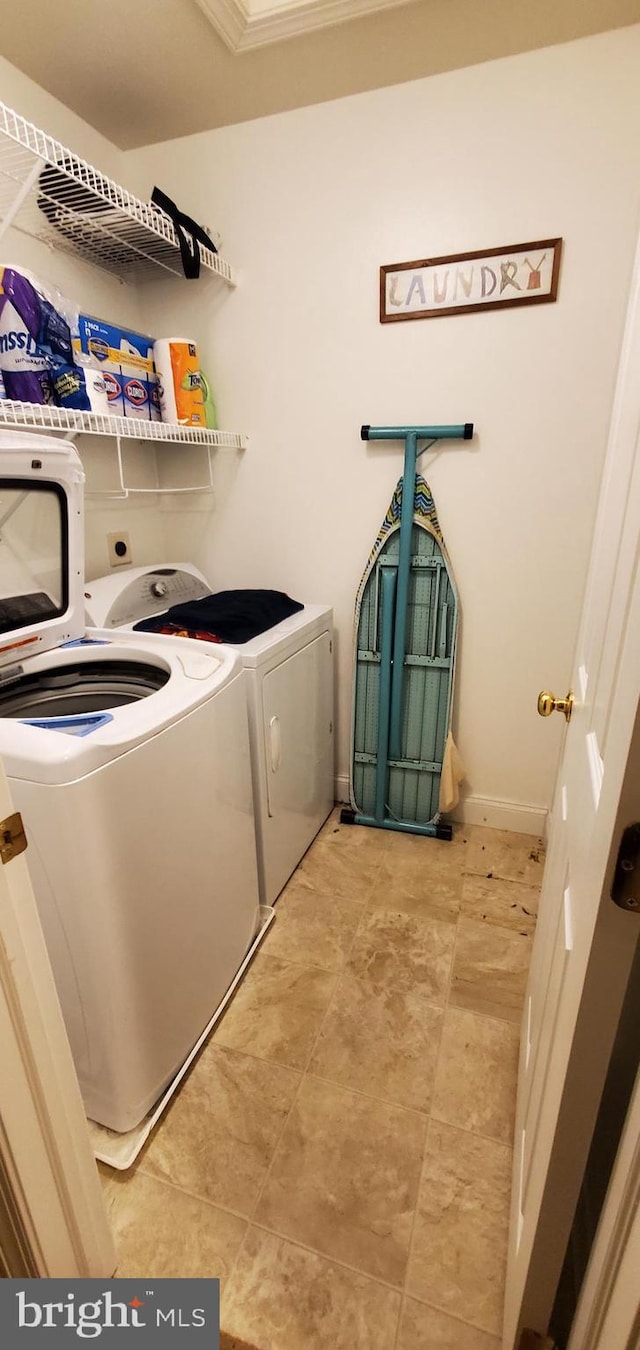 laundry area with washing machine and dryer