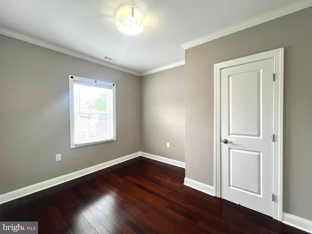 1208 Shepherd St NW, Washington, DC 20011 - spare room featuring dark wood-type flooring, baseboards, and crown molding