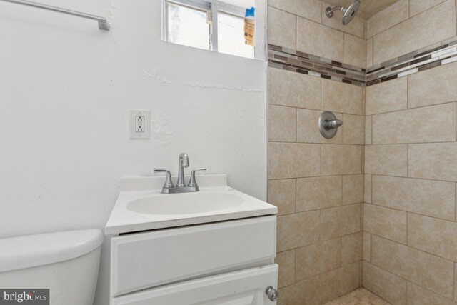 1208 Shepherd St NW, Washington, DC 20011 - bathroom with vanity, tiled shower, and toilet