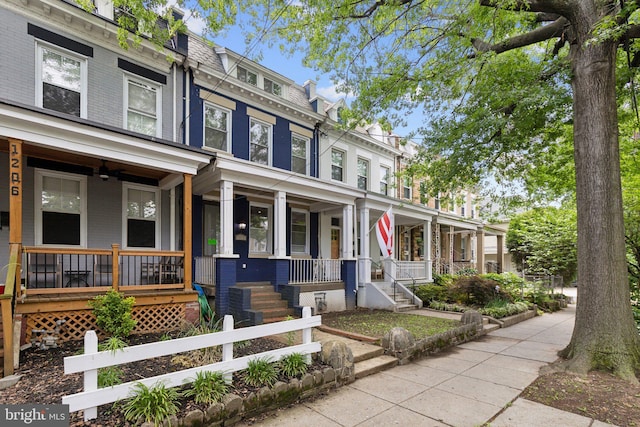 1208 Shepherd St NW, Washington, DC 20011 - view of front of home with covered porch, mansard roof, and brick siding
