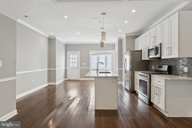 1208 Shepherd St NW, Washington, DC 20011 - kitchen with stainless steel appliances, a sink, a center island with sink, ornamental molding, and decorative backsplash