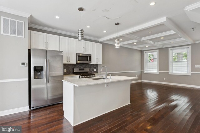 1208 Shepherd St NW, Washington, DC 20011 - kitchen with appliances with stainless steel finishes, a sink, an island with sink, tasteful backsplash, and dark wood-style floors