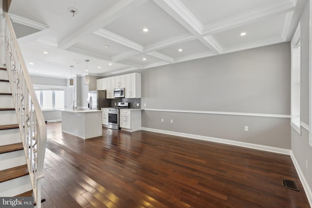 1208 Shepherd St NW, Washington, DC 20011 - unfurnished living room with coffered ceiling, dark wood-type flooring, stairs, beam ceiling, and ornamental molding