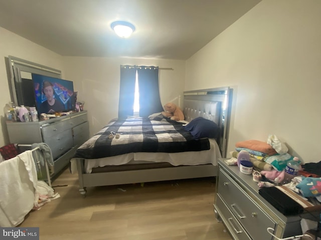 bedroom featuring wood finished floors
