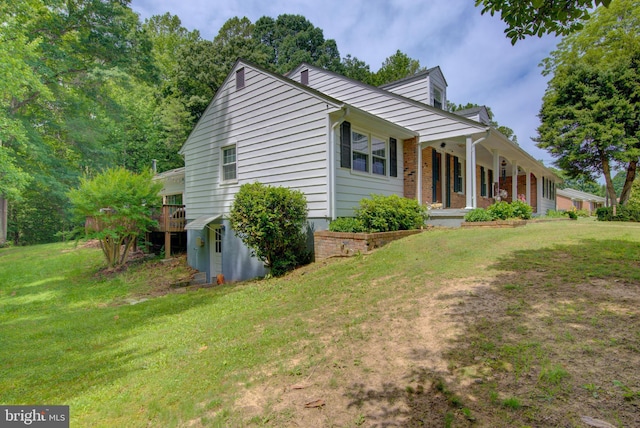 8406 Cedar Ln, King George, VA 22485 - view of front of home featuring a front lawn, a porch, and a storage unit