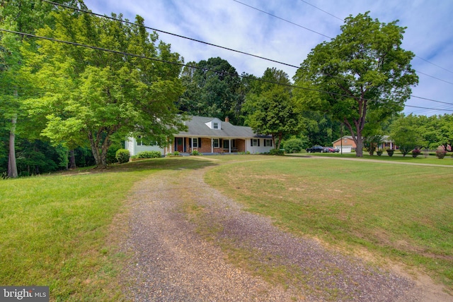 8406 Cedar Ln, King George, VA 22485 - cape cod house featuring driveway, a front lawn, and a porch