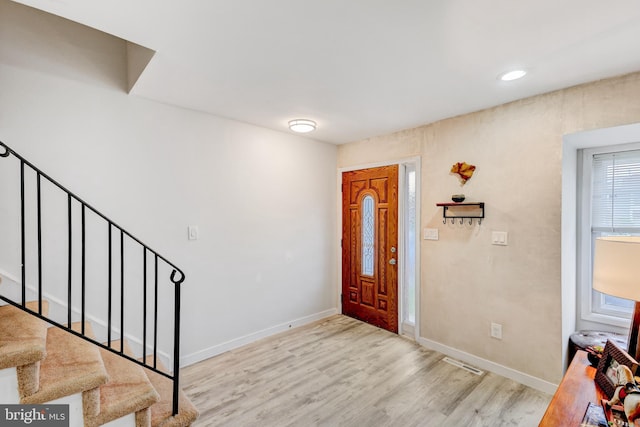 384 Bolton Rd, East Windsor, NJ 08520 - entryway with stairs, light wood finished floors, and baseboards