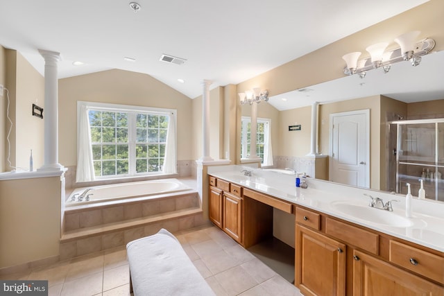 full bathroom with ornate columns, a bath, a stall shower, double vanity, and vaulted ceiling