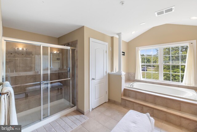 bathroom with a shower stall, tile patterned flooring, a garden tub, ornate columns, and lofted ceiling