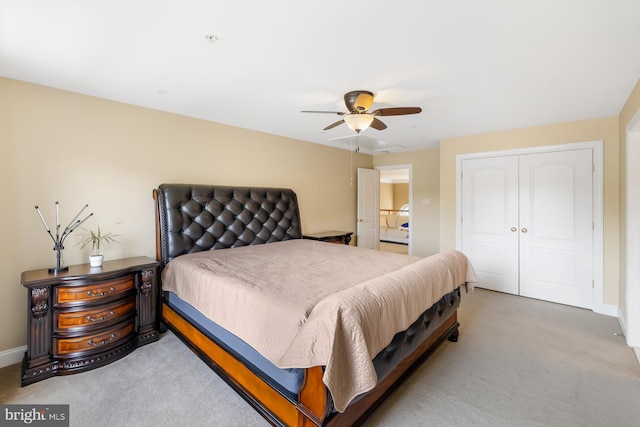 bedroom with carpet floors, a closet, and baseboards