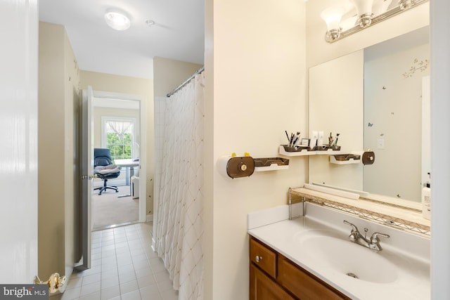 bathroom with tile patterned flooring and vanity