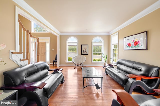 living room featuring ornamental molding, wood-type flooring, stairway, and baseboards