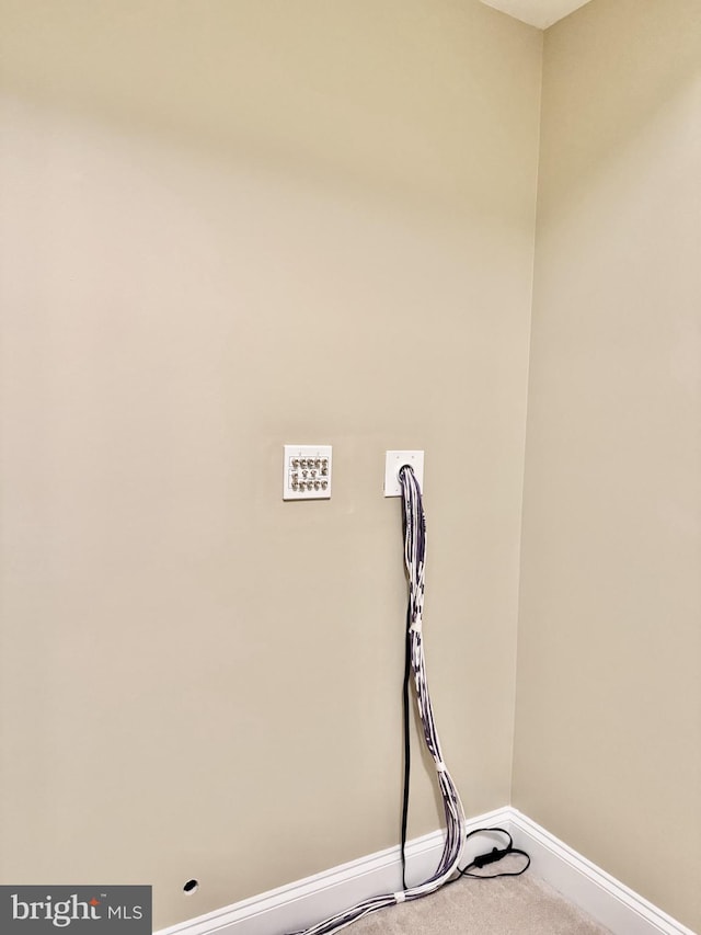 detailed view of baseboards and carpet floors