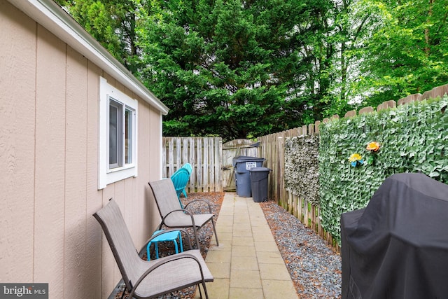 9910 Warwick Pl, Fredericksburg, VA 22408 - fenced backyard with area for grilling and a patio area