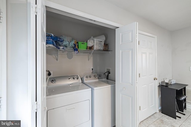 9910 Warwick Pl, Fredericksburg, VA 22408 - washroom with washing machine and dryer and light tile patterned flooring