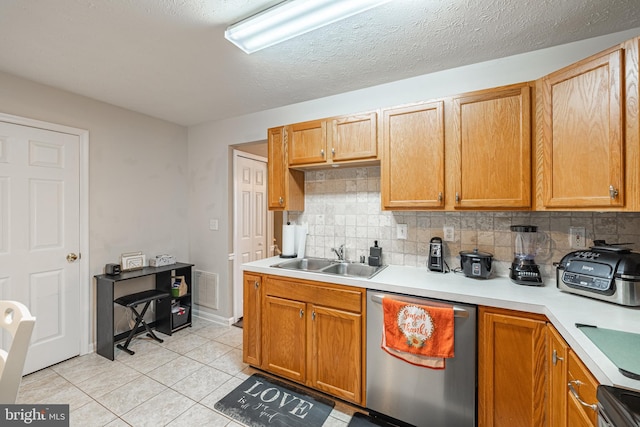 9910 Warwick Pl, Fredericksburg, VA 22408 - kitchen featuring appliances with stainless steel finishes, a sink, backsplash, light countertops, and light tile patterned flooring