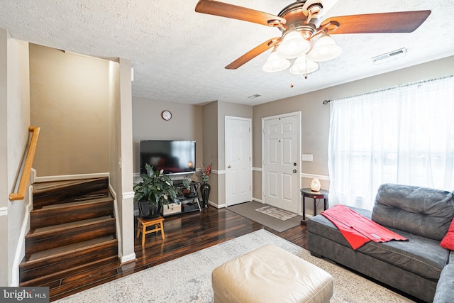 9910 Warwick Pl, Fredericksburg, VA 22408 - living room with wood finished floors, a ceiling fan, a textured ceiling, stairway, and baseboards