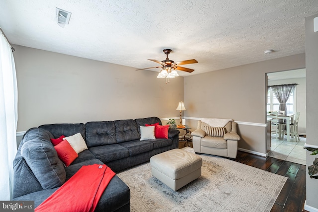 9910 Warwick Pl, Fredericksburg, VA 22408 - living room featuring hardwood / wood-style flooring, ceiling fan, a textured ceiling, and baseboards
