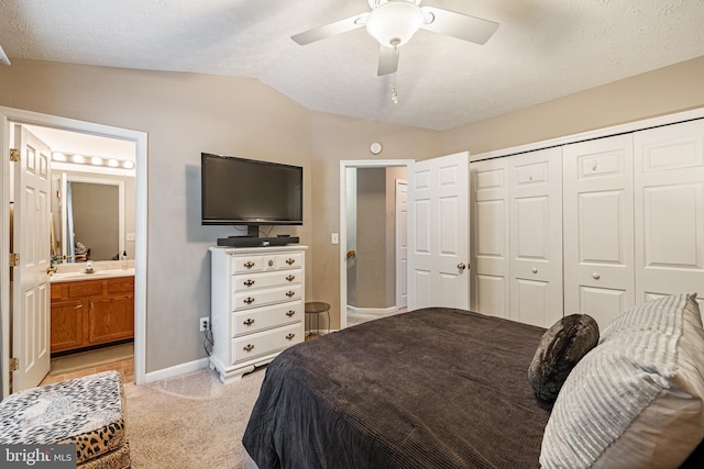 9910 Warwick Pl, Fredericksburg, VA 22408 - bedroom featuring lofted ceiling, light carpet, a closet, baseboards, and connected bathroom