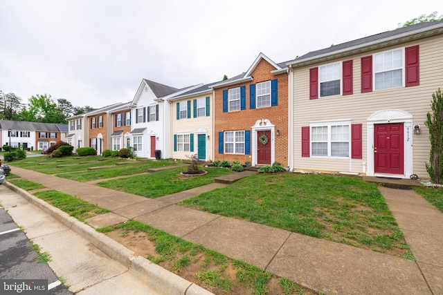 9910 Warwick Pl, Fredericksburg, VA 22408 - multi unit property featuring a front lawn, a residential view, and brick siding