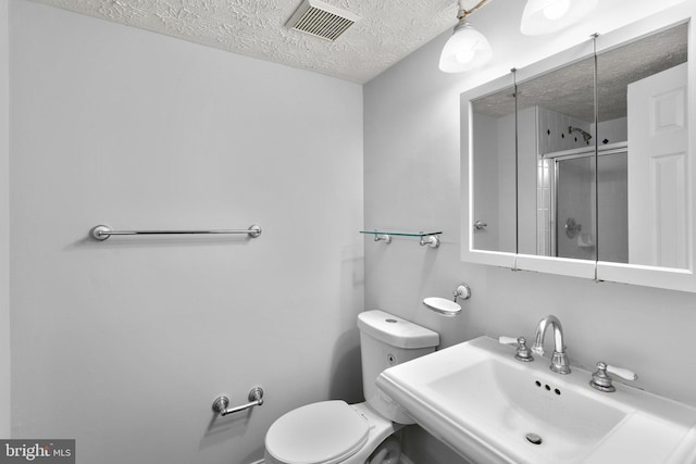 1476 Greenbriar Cir Unit 1-1476, Pikesville, MD 21208 - full bath with a sink, a textured ceiling, a stall shower, and toilet