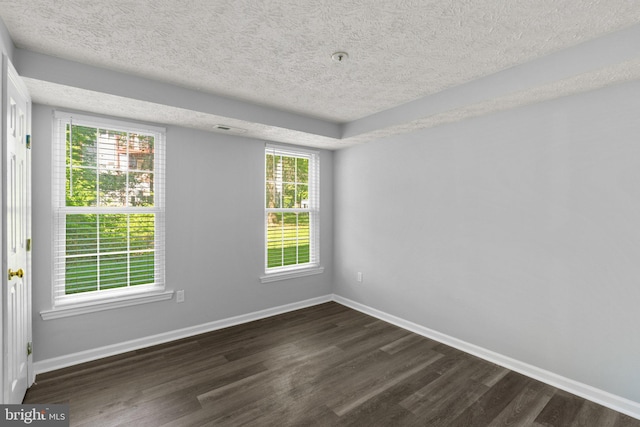 1476 Greenbriar Cir Unit 1-1476, Pikesville, MD 21208 - empty room featuring dark wood-type flooring, a textured ceiling, and baseboards