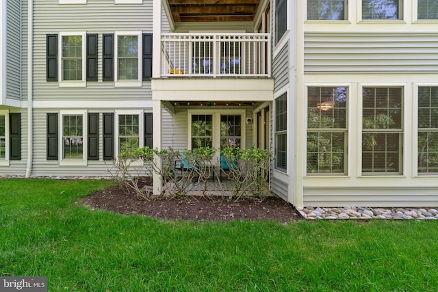 1476 Greenbriar Cir Unit 1-1476, Pikesville, MD 21208 - rear view of property with a balcony and a lawn