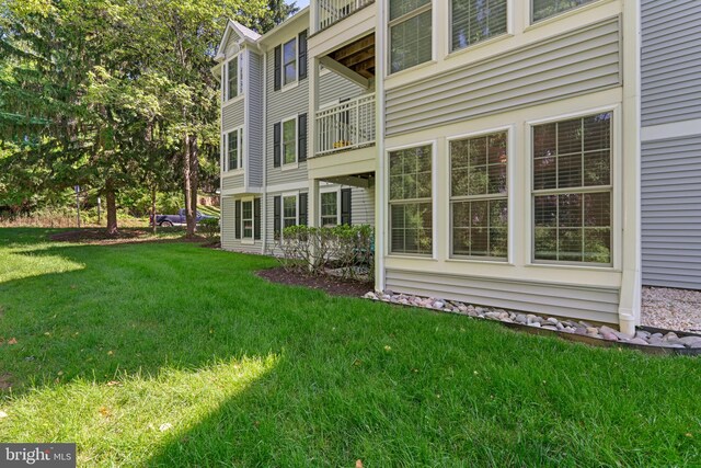 1476 Greenbriar Cir Unit 1-1476, Pikesville, MD 21208 - view of side of home with a yard