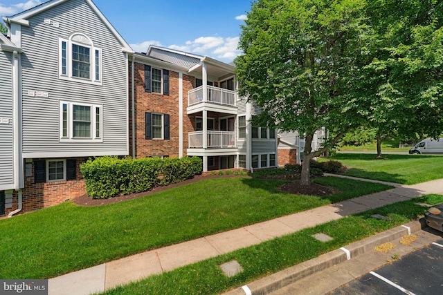 1476 Greenbriar Cir Unit 1-1476, Pikesville, MD 21208 - view of property featuring uncovered parking