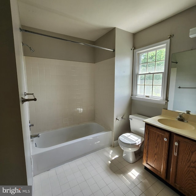 full bath featuring tile patterned floors, bathing tub / shower combination, toilet, and vanity