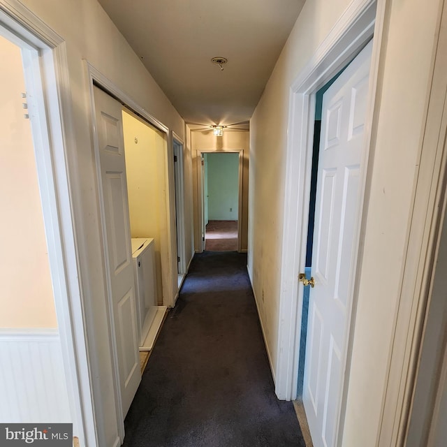 corridor with dark carpet