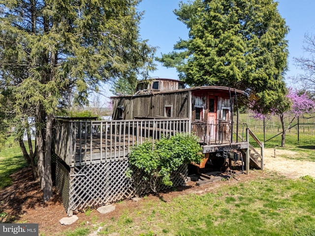 back of property with a deck