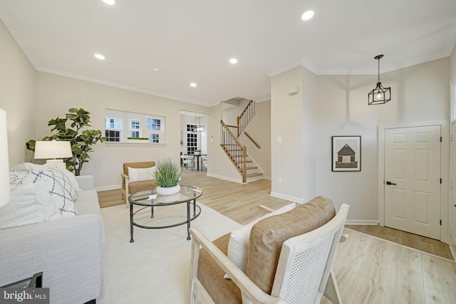 47670 Woolcott Sq, Sterling, VA 20165 - living area with stairs, light wood-style flooring, baseboards, recessed lighting, and crown molding