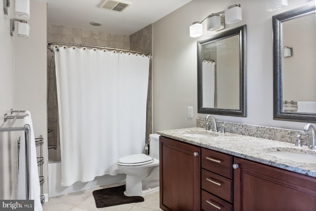 full bath featuring toilet, double vanity, tile patterned floors, and shower / tub combo