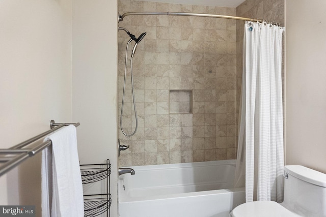 bathroom featuring toilet and shower / tub combo